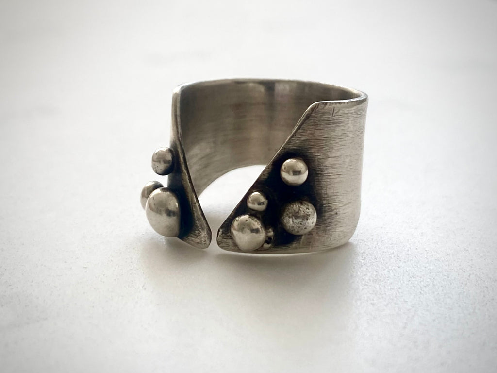  Side view of sculptural 925 silver ring showing hand-hammered texture and fused silver granules, one-of-a-kind handcrafted jewelry